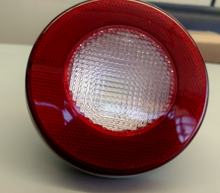 Faro marcha atras cristal redondo aro rojo 125mm c/tor. i/d - Imagen principal