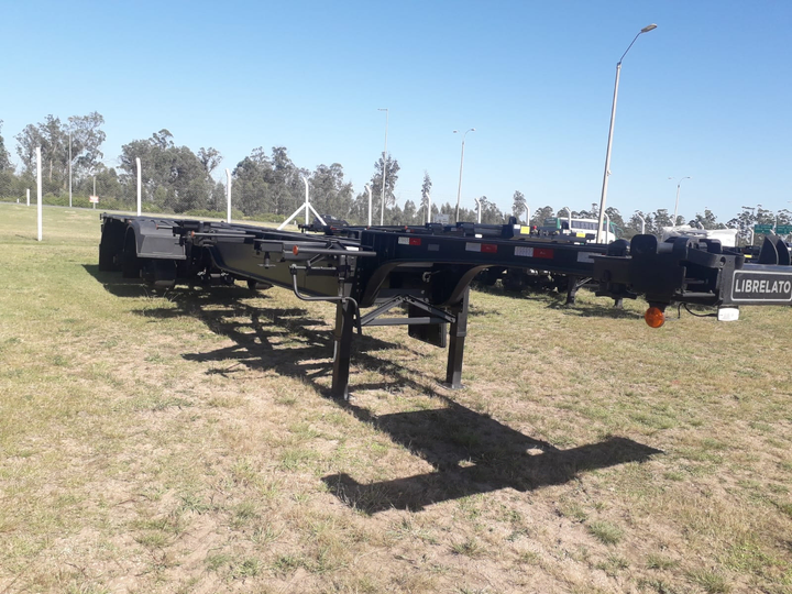 Semi porta contenedor 20-40 multiproposito 12pinos 1+1 neum abs - Imagen principal